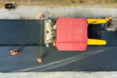 aerial-view-of-new-road-construction-with-asphalt-2024-12-06-05-06-47-utc.jpg
